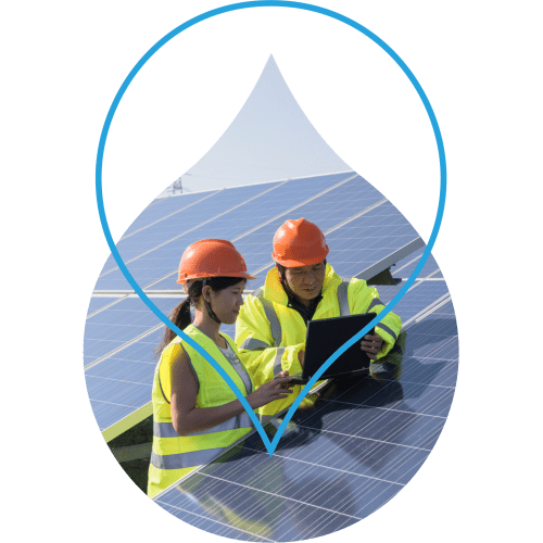 Image of 2 people working on solar panels in a cropped region of the Acquia Droplet