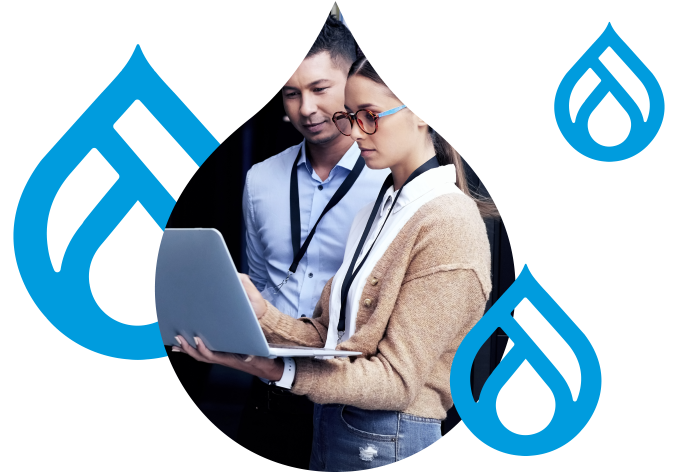 stylized graphic of Drupal Logos surrounding two people looking over a laptop