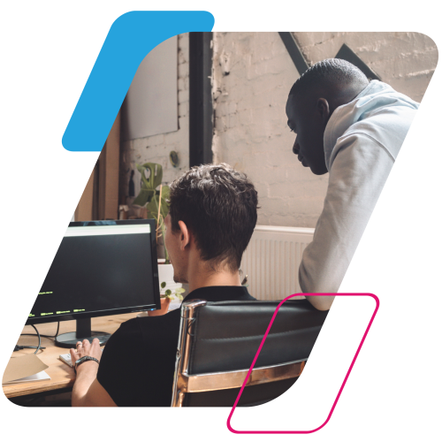 Pink and blue parallelograms with an image of two people looking over a computer