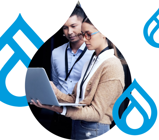 stylized graphic of Drupal Logos surrounding two people looking over a laptop